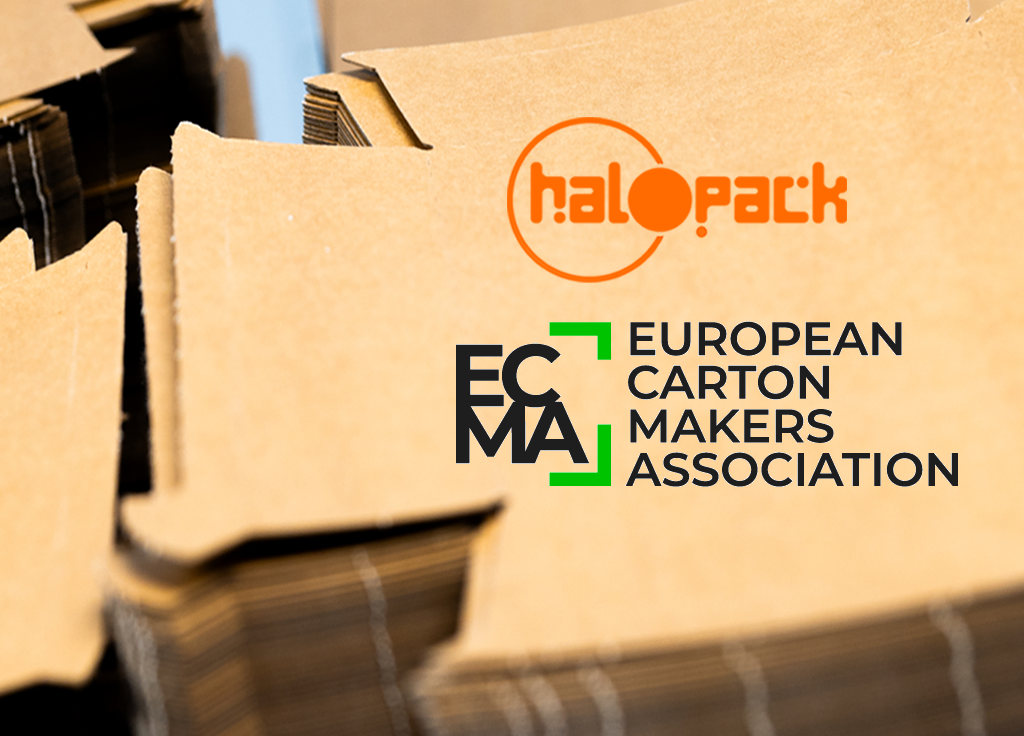 Halopack and ECMA logo on a pile of unfolded carton trays.